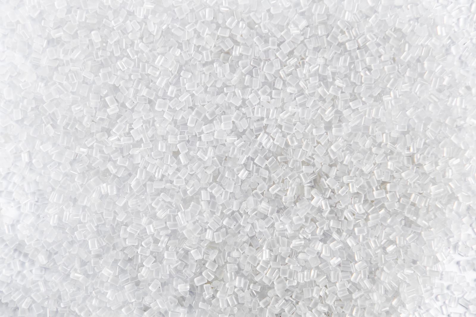 Close-up of polymer resin granules, illustrating the material level substance evidence held by converters and resin suppliers