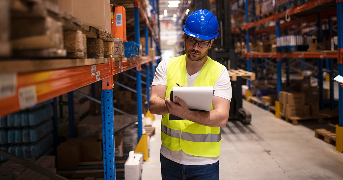 Warehouse supervisor recording an inventory hold on affected packaging stock