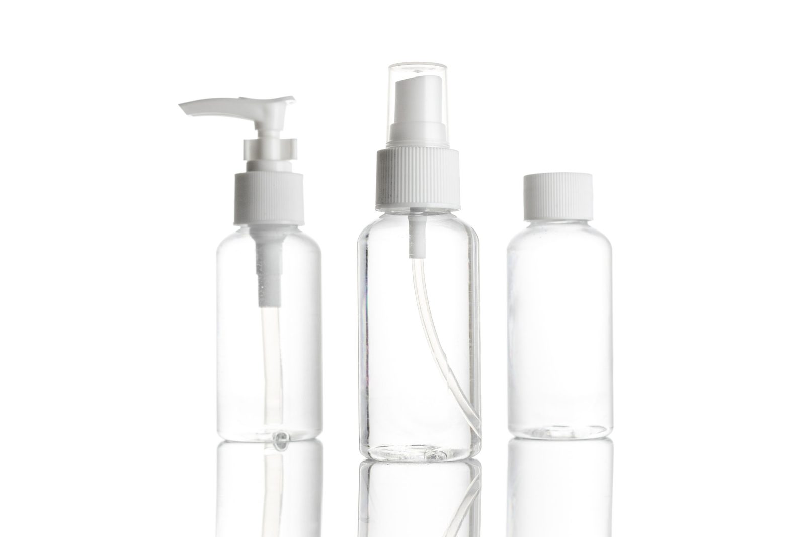 A single white pump bottle for shampoo or personal care product on a plain background