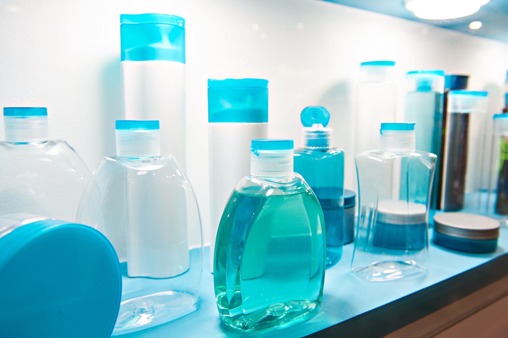 Retail display of shampoo bottles on shop shelves